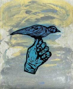 Blå hand med fågel