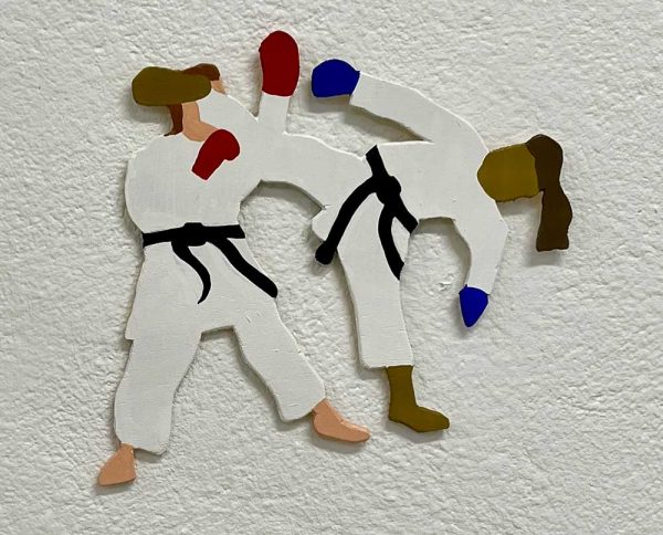 ”Karate” är ett verk av Oskar Palmbäck gjort år 2024. Tekniken är akryl och vinyl på utskuren poppelplywood i ett unikt exemplar. Verket mäter 23 x 27 cm. Signerat av konstnären.